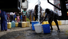 A file image of people fetching water.